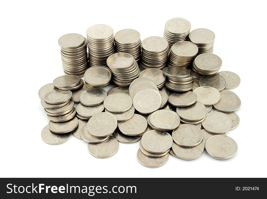 Stacks of 10 pence Pieces on a w hite background. Stacks of 10 pence Pieces on a w hite background