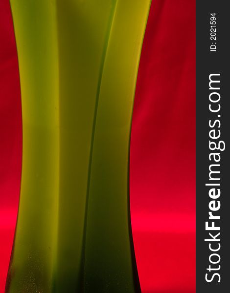 Green abstract shape over red background. Green abstract shape over red background