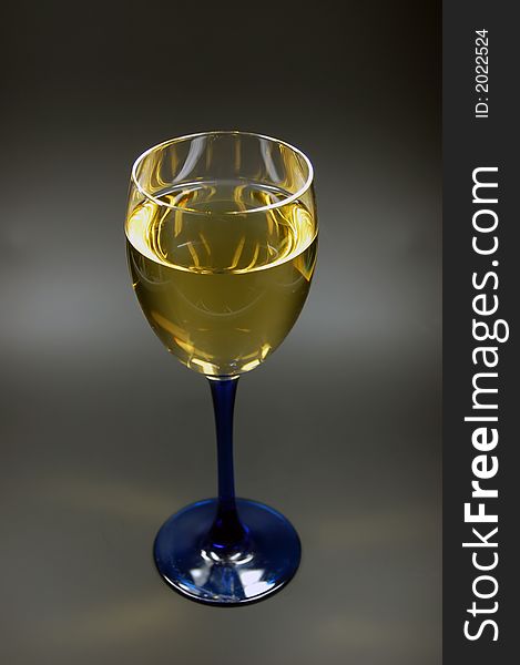 Wineglass with blue stem and chardonnay