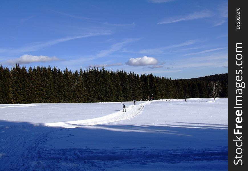 Skiing runner on moutains in winter