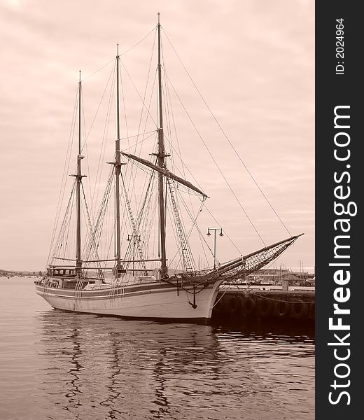 An old sailship by quay