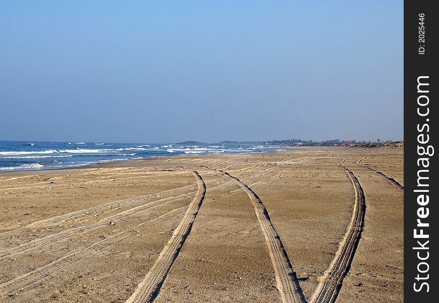 Traces of a motor vehicle on sea coast. Traces of a motor vehicle on sea coast