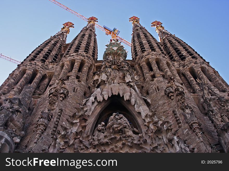 Front facade and towers of La Sagrada Familia in Barcelona Spain