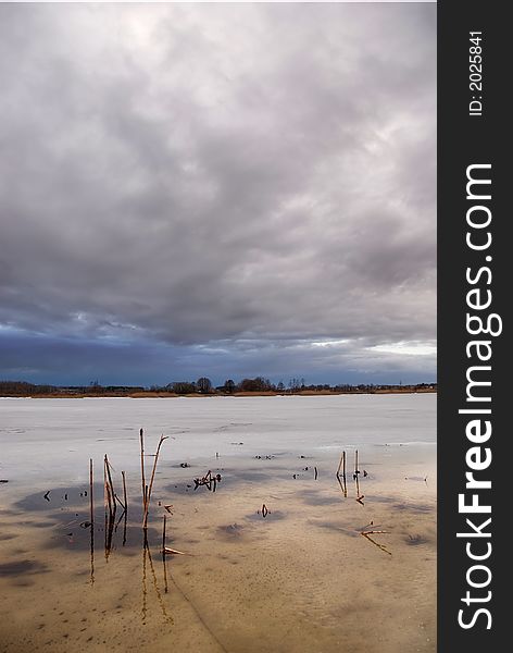 Stormy clouds over a frozen lake. Stormy clouds over a frozen lake