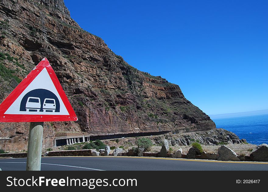 Tunnel sign on Cape Town's re-engineered Chapman's Peak drive.preventing falling rocks. Tunnel sign on Cape Town's re-engineered Chapman's Peak drive.preventing falling rocks