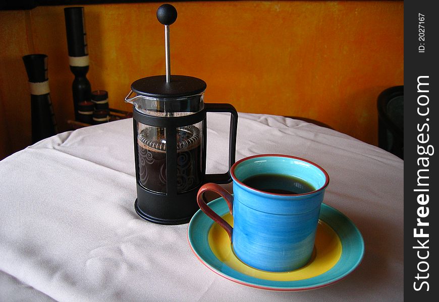 Coffee cup with coffee on table