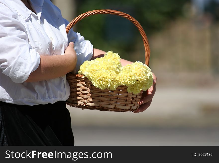 Woman with a basket with flowers