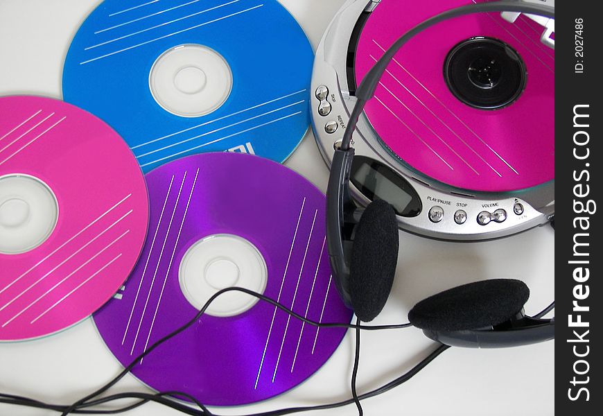 Colorful discs with a portable CD player. Colorful discs with a portable CD player