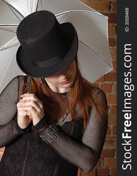 This girl is holding a photography umbrella. This girl is holding a photography umbrella.