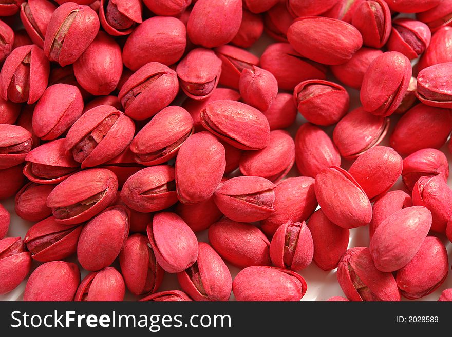 Red pistachios on a white background. Red pistachios on a white background