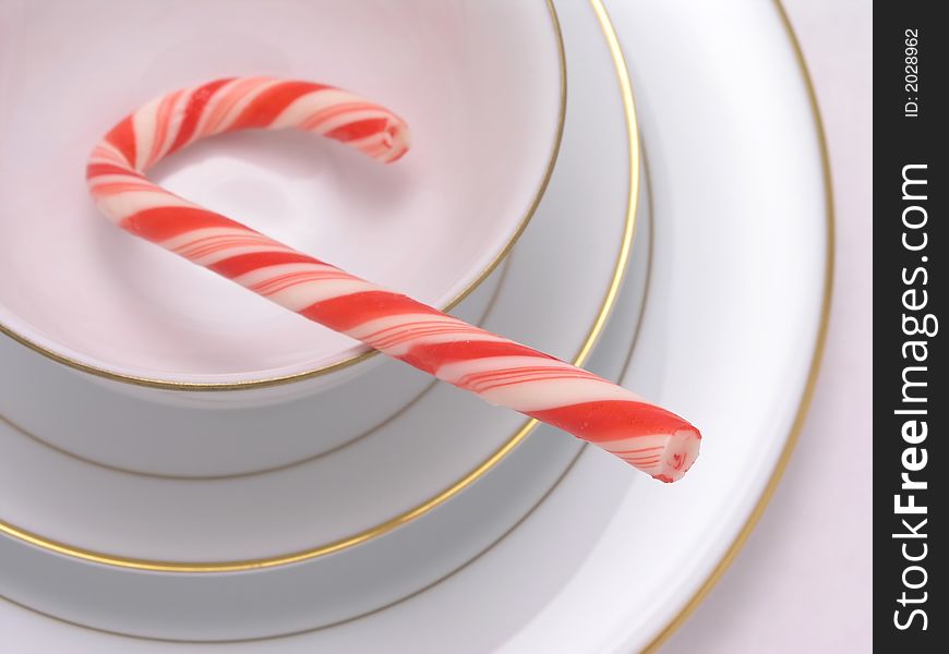 Red and White Candy cane in cup
