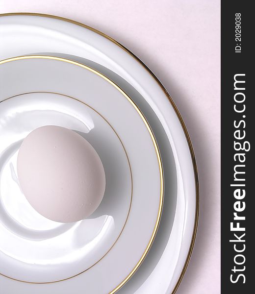 Egg on fine china saucer and plate. Egg on fine china saucer and plate