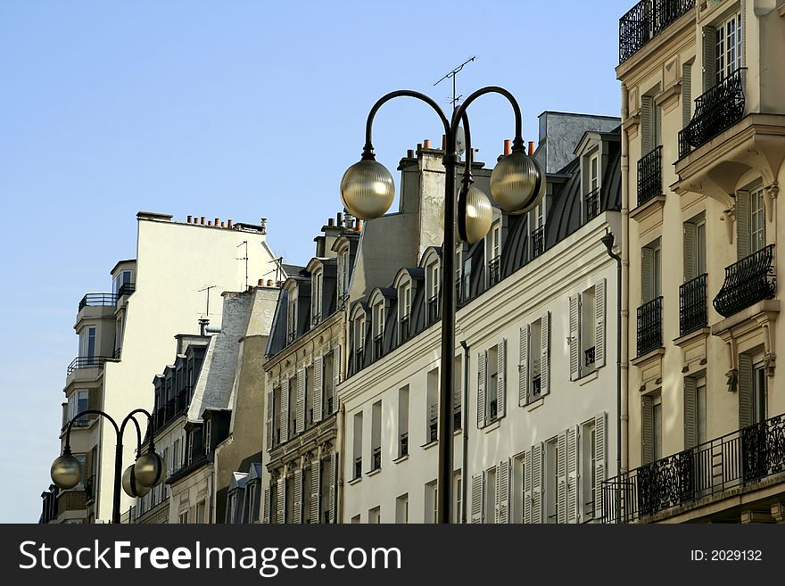 Very nice Parisian homes with an elegant street lamp. Very nice Parisian homes with an elegant street lamp