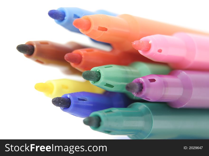 Coloured pens against a white background