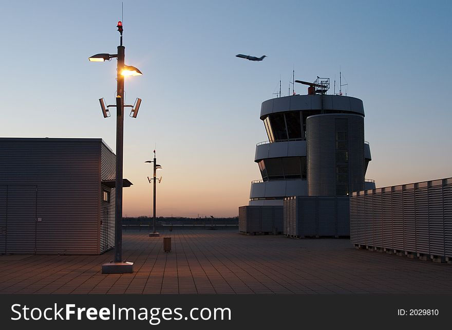 Airport Tower with Airplane at dawn