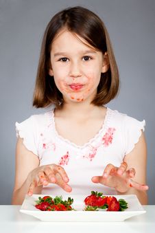 Little Girl Eating Strawberries Stock Image Little Girl Eating Strawberries Stock Image