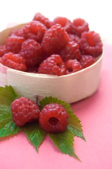 Raspberries In Wooden Basket Stock Images