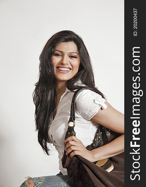 Attractive Indian girl with hand bag. Attractive Indian girl with hand bag