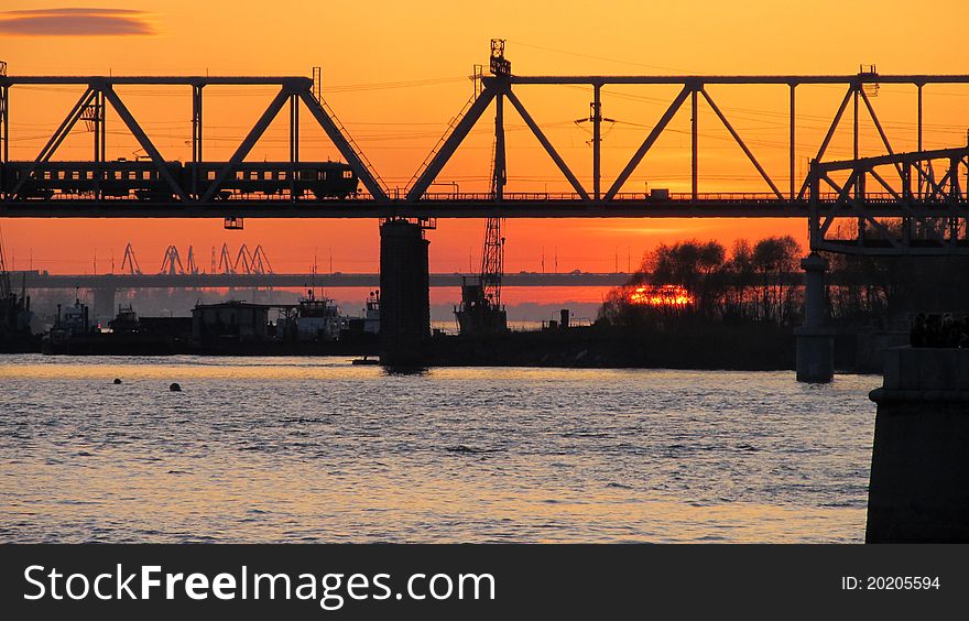 Sunset behind the railway bridge. Sunset behind the railway bridge