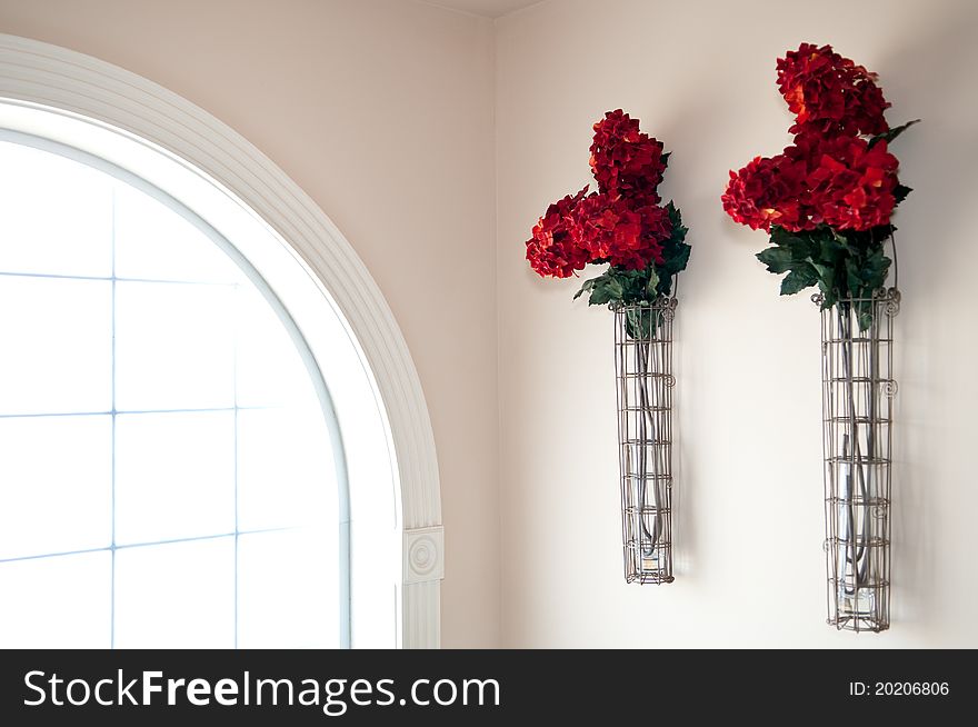 Red Flowers Beside Window