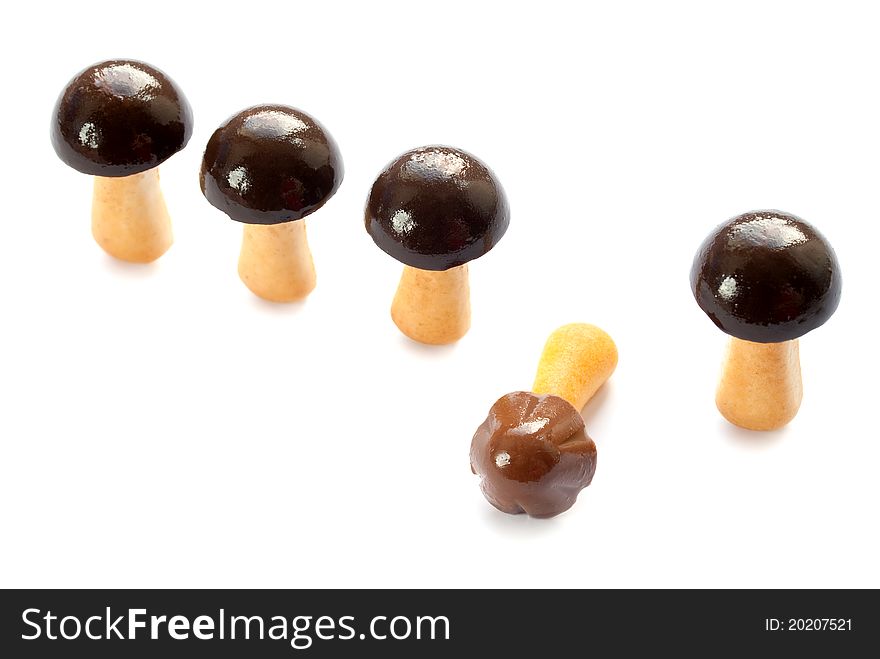 Cookies with chocolate in the form of mushrooms. Isolated on a white background