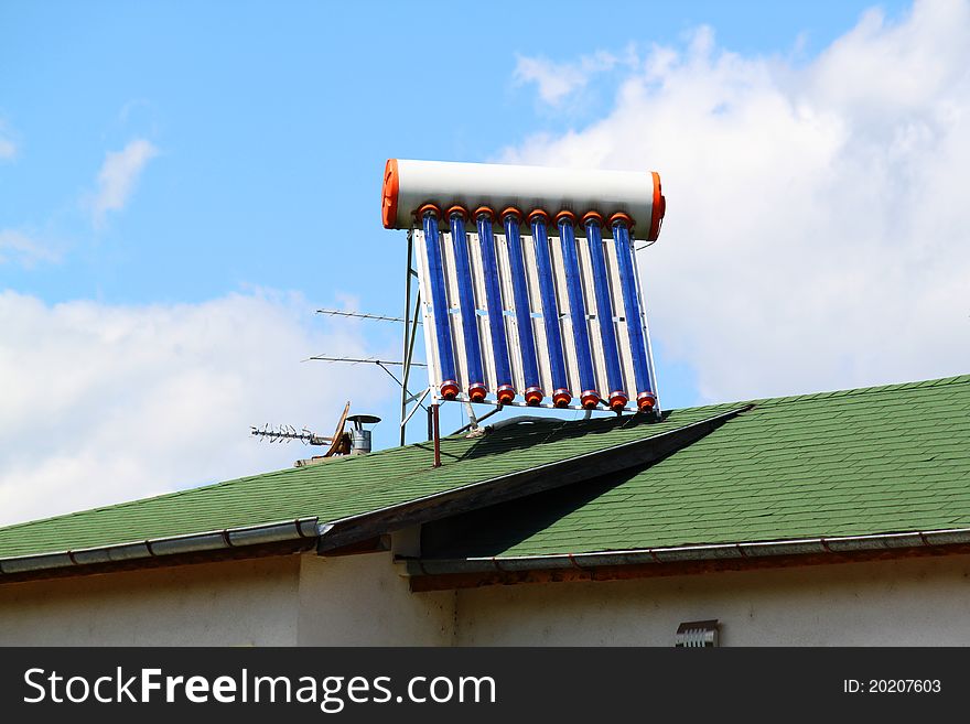 Solar water heater on the roof of a house.