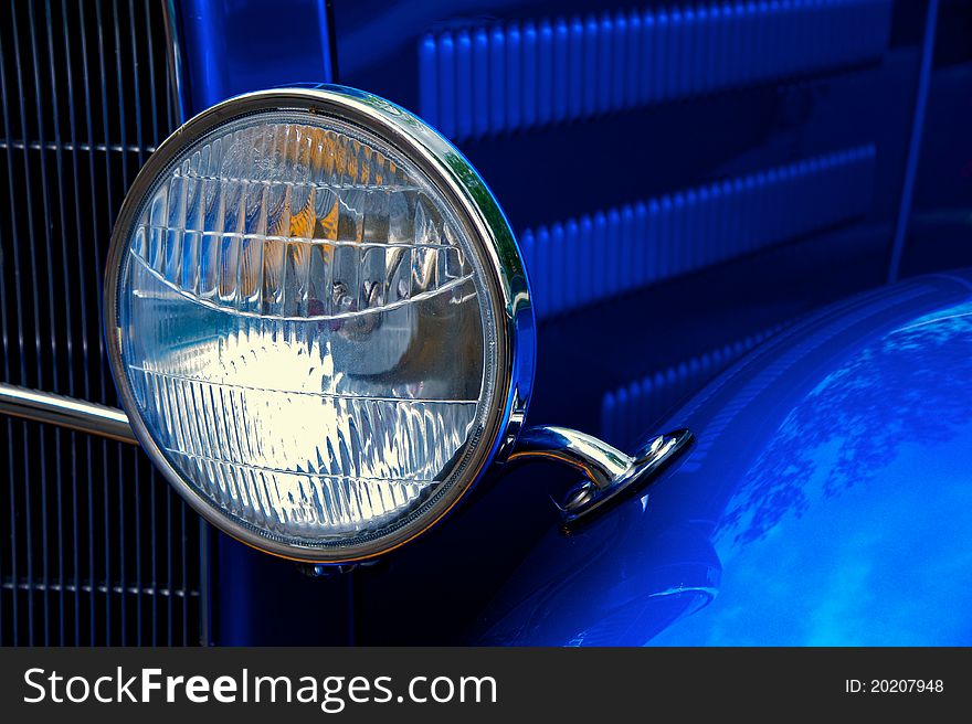 Detail of vintage American car's headlight. Detail of vintage American car's headlight