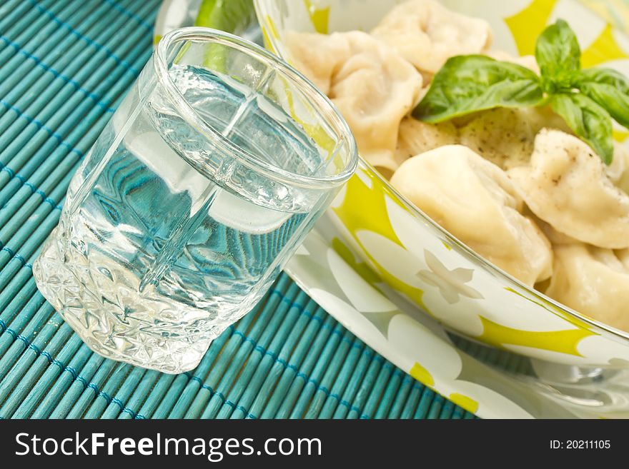 Russian vodka and Russian national pelmeni. Russian vodka and Russian national pelmeni