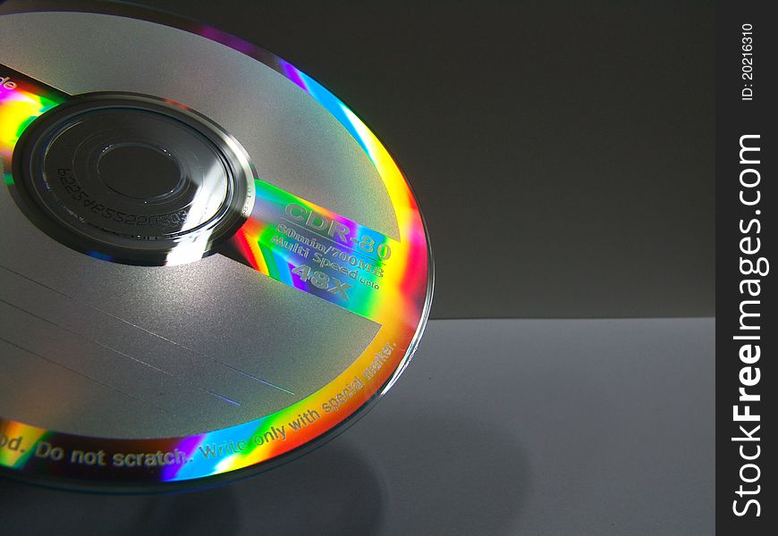 A shot of a cd with colorful reflections on it