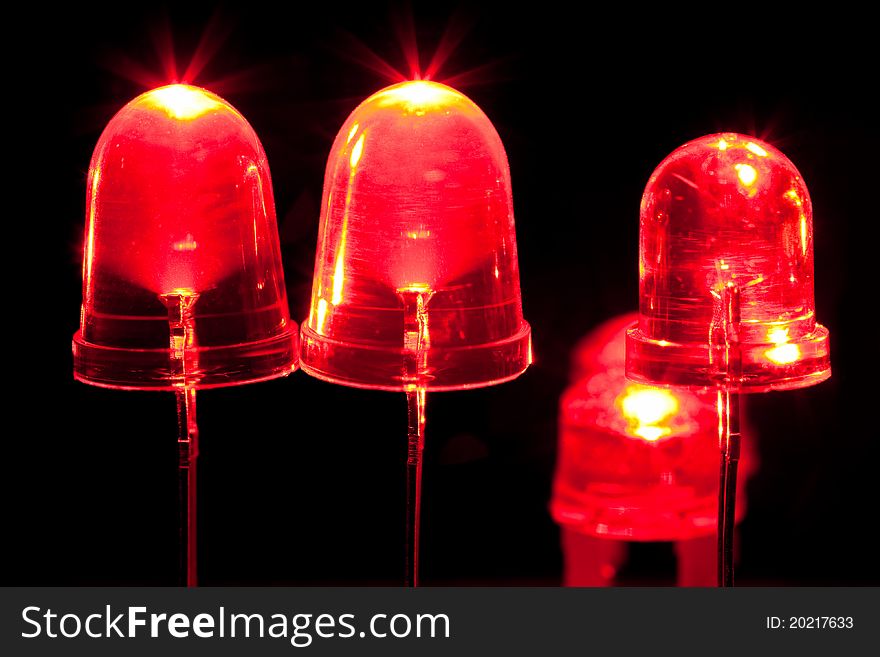 Glowing red LEDs against black background.