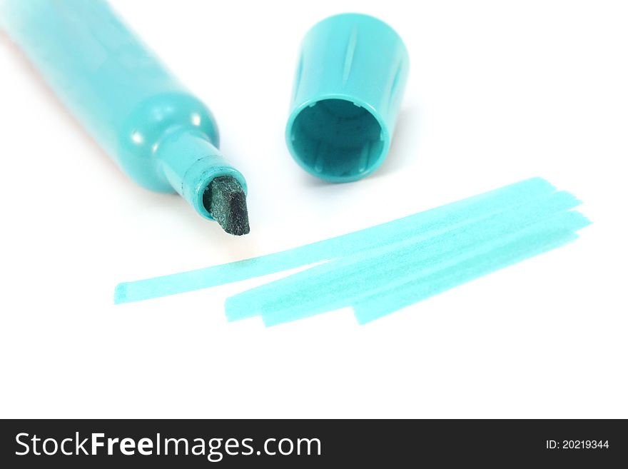 Blue highlighter with markings on white paper