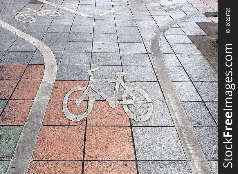 Bike and human signs on a footpath. Bike and human signs on a footpath