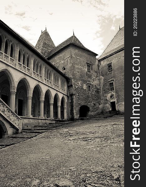 Black and white image of an old castle courtyard