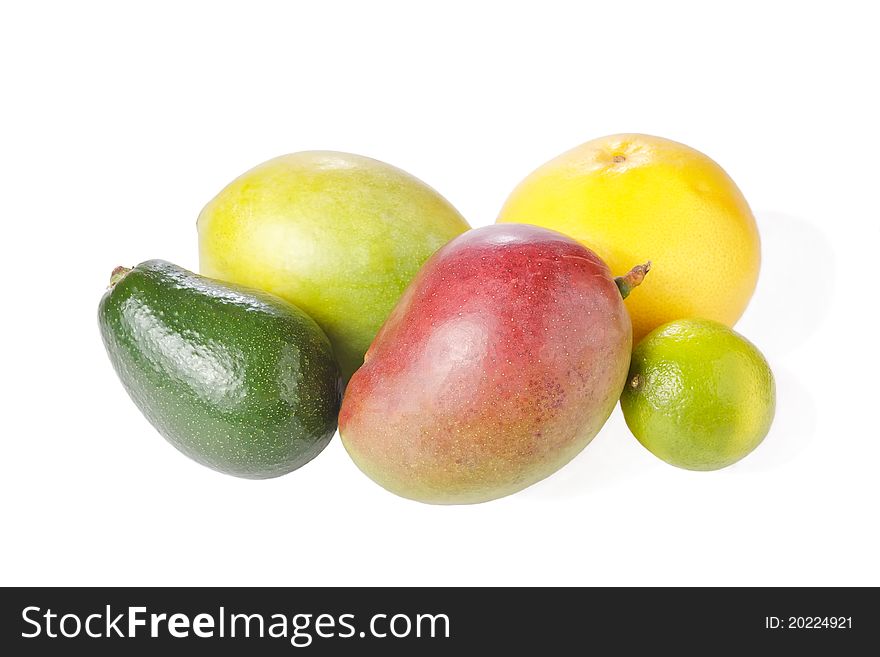 Mix of fresh tropical fruits isolated on white (avocado, grapefruit, mango, lime). Mix of fresh tropical fruits isolated on white (avocado, grapefruit, mango, lime)