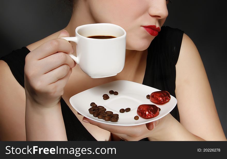 Woman holding a cup of black coffee. Woman holding a cup of black coffee