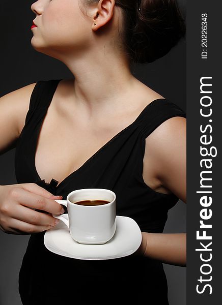 Woman holding a cup of black coffee. Woman holding a cup of black coffee