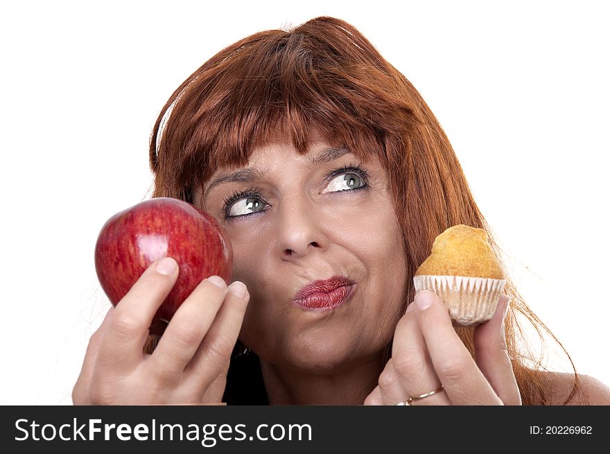 Redhead woman with apple muffin