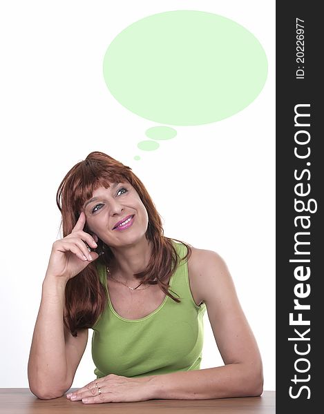 Pensive redhead woman on white background