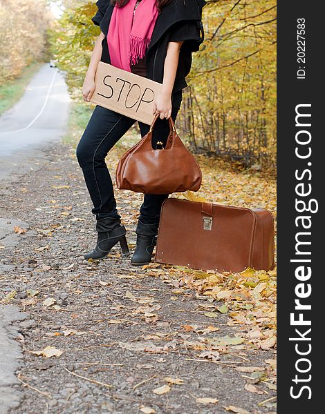 Hitchhiking the road, stop, handbag