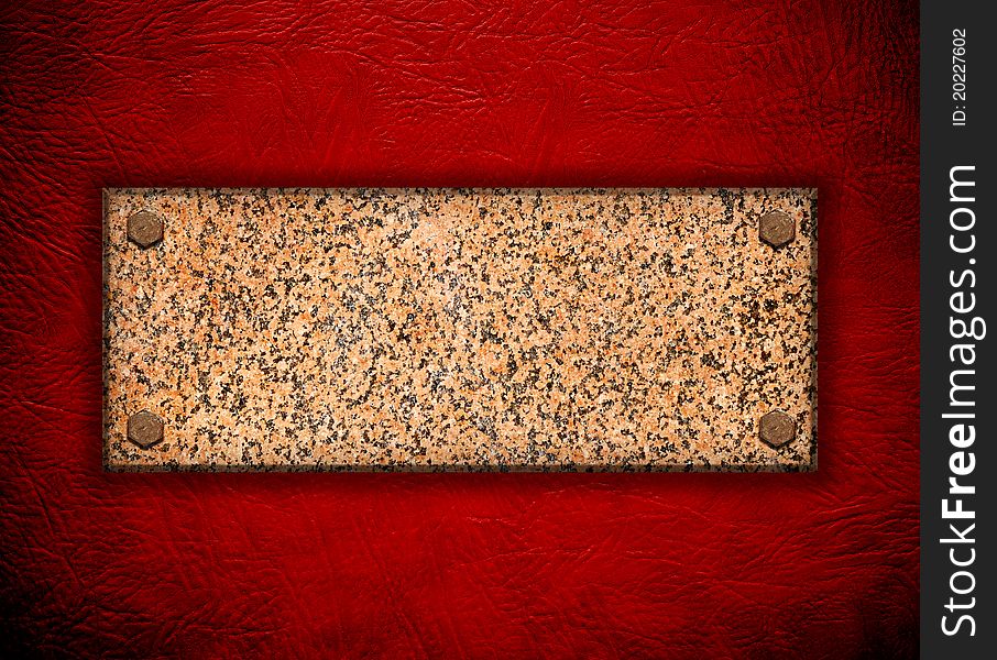 Granite stone on red wall