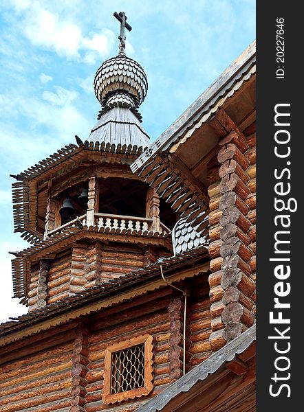 The bell tower with a dome and a cross, made in the old Russian style. The bell tower with a dome and a cross, made in the old Russian style