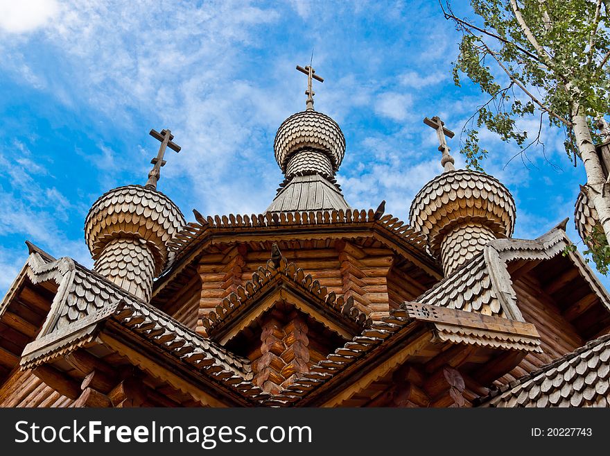 A wooden church was built in the old Russian style at the blue sky