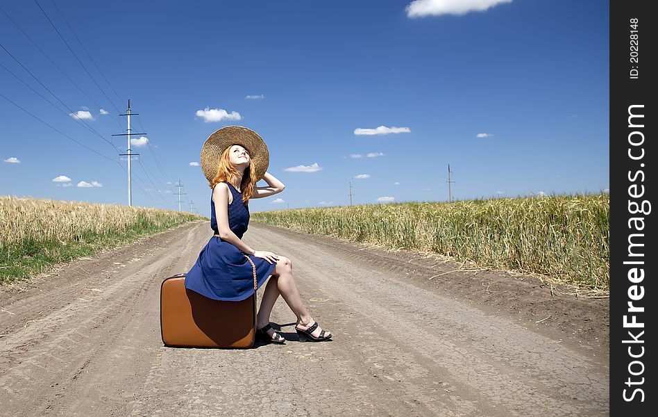 Lonely Girl With Suitcase At Country Road.