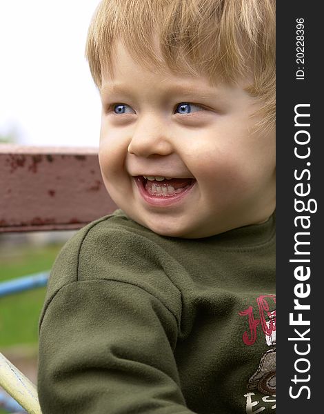 Portrait of the little smiling boy in the street. Portrait of the little smiling boy in the street