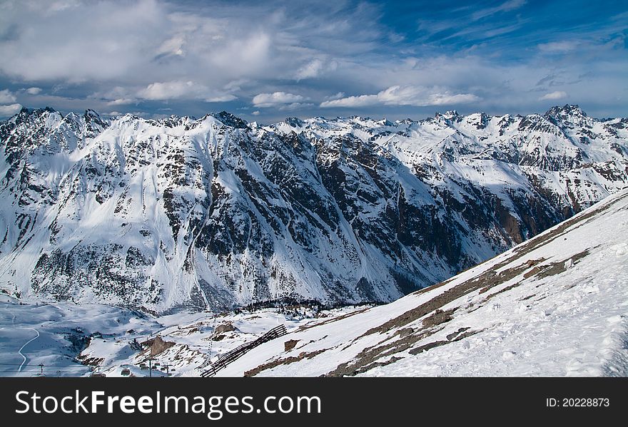 Alpine mountains covered by snow. Alpine mountains covered by snow