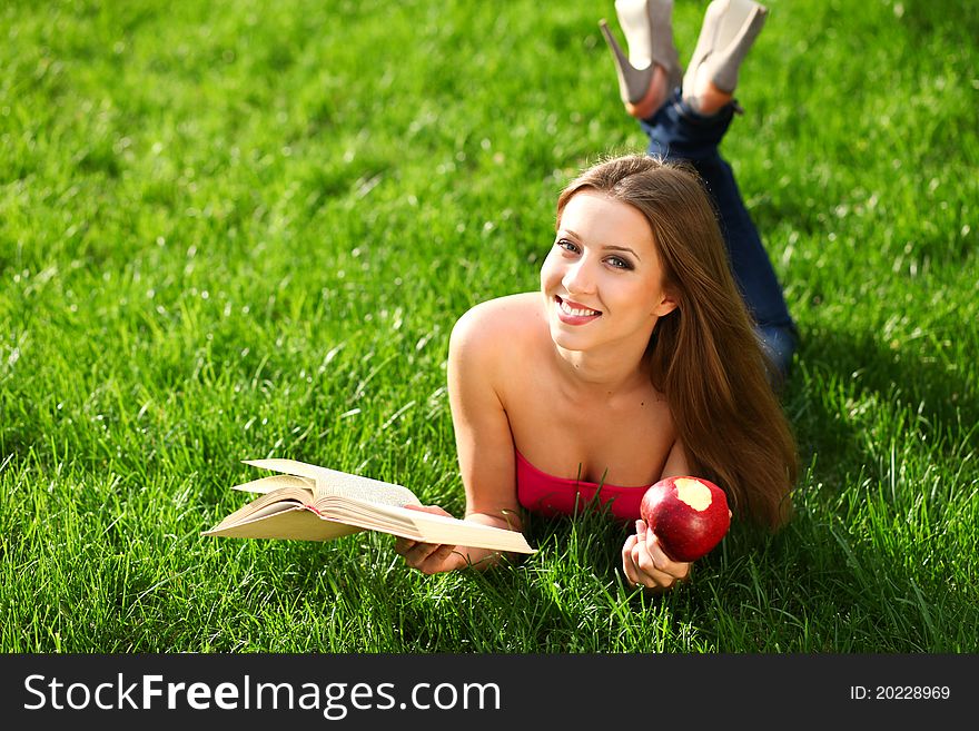 Woman in the park with book