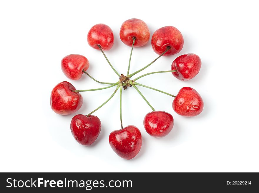 Sweet cherries in circle shape isolated on white background