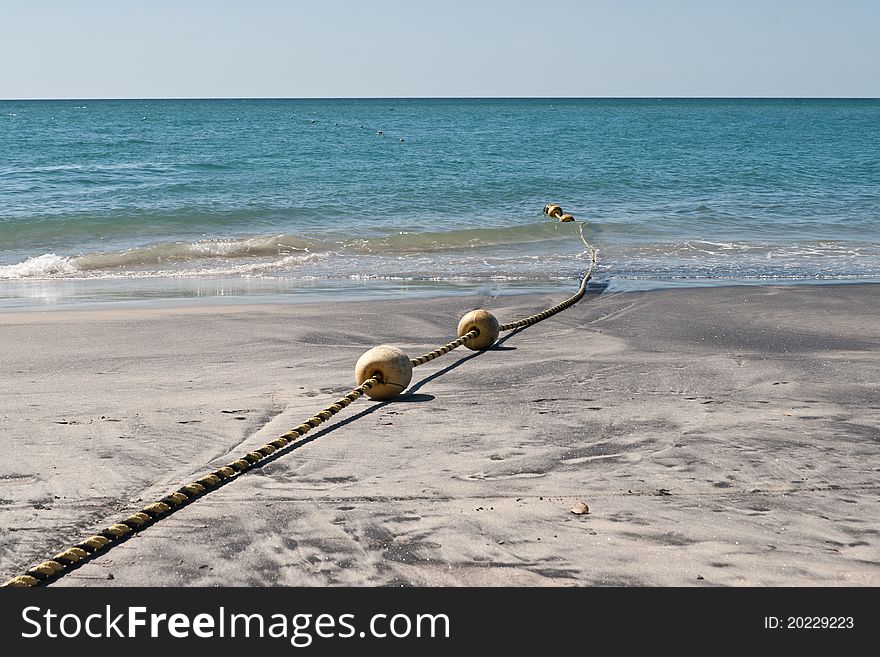 Buoys On Sandy Beach