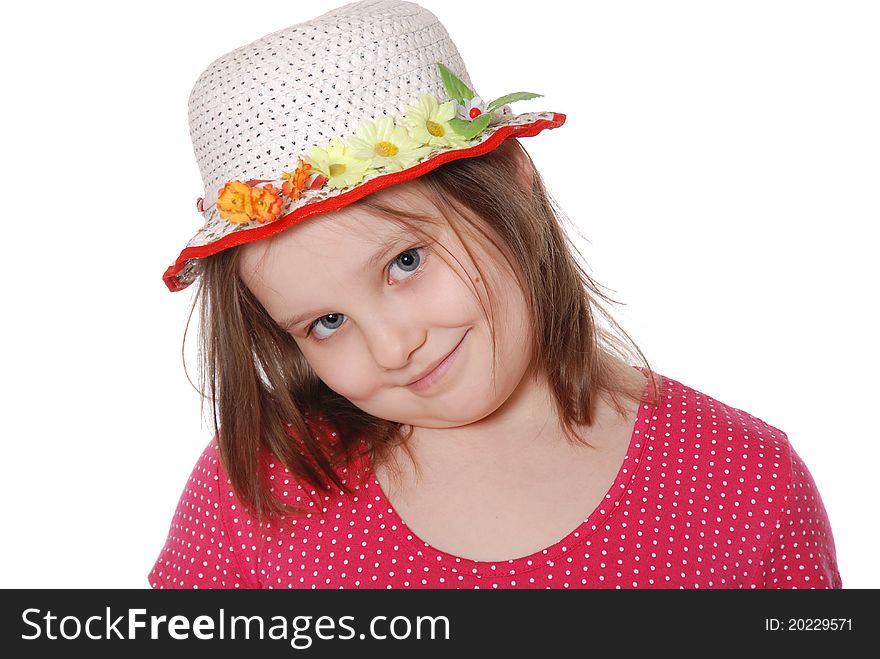 Portrait of little girl wearing a hat ans smiling isolated on white background