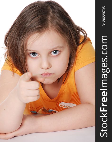 The little girl, points a finger isolated on white background